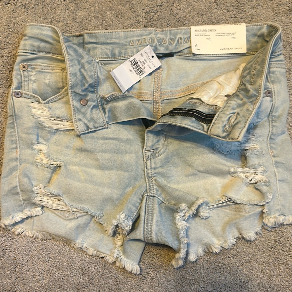 American Eagle Light washed denim shorts. NEVER WORN!!!